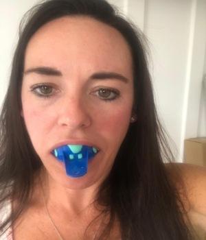 Place tray in mouth and bite down gently